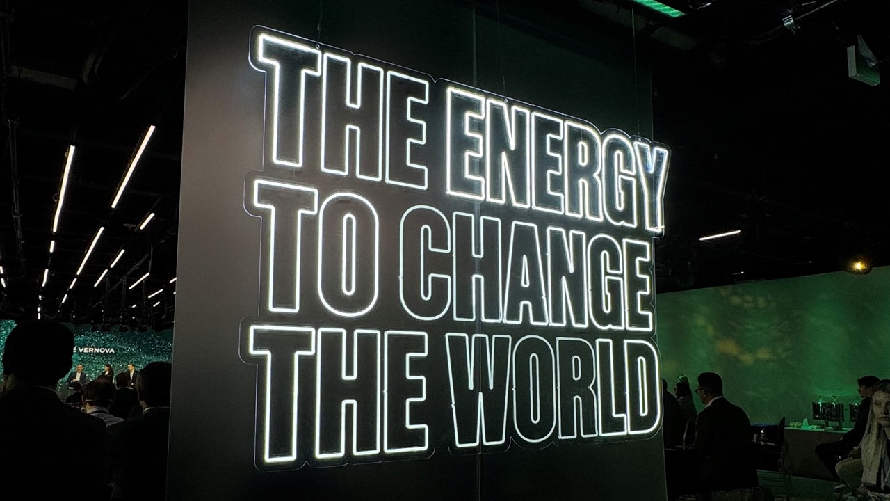 Neon sign that reads The Energy to Change the World